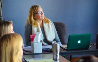 A woman speaking about addiction counseling skills.
