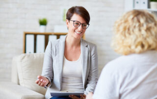 an addiction counselor talking to her patient