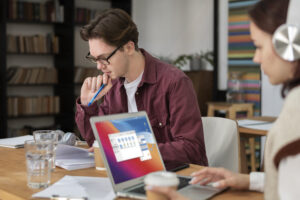 girl-with-headphones-using-laptop-along-her-classmates-group-study Learning-Option
