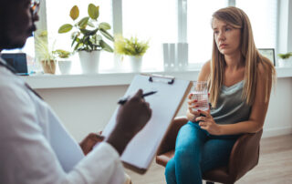 certified addiction counselor with a patient